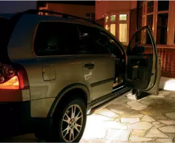 a picture showing a car on a drive way with the lights under the car on